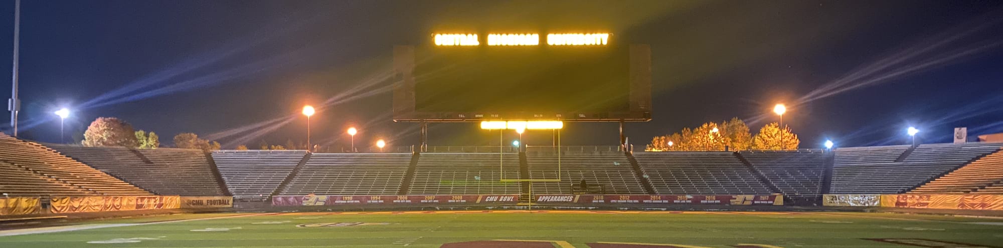 empty football stadium at night under the lights Fort Myers