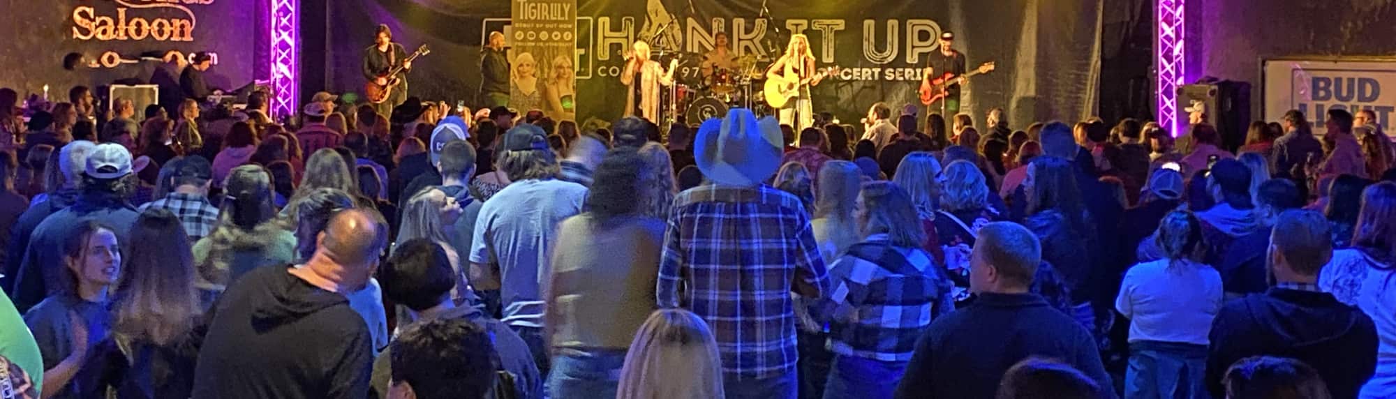 country concert with fans wearing cowboy hats Fort Myers